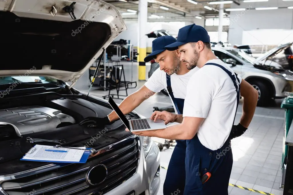 Taller mecánico con vehículos en reparación